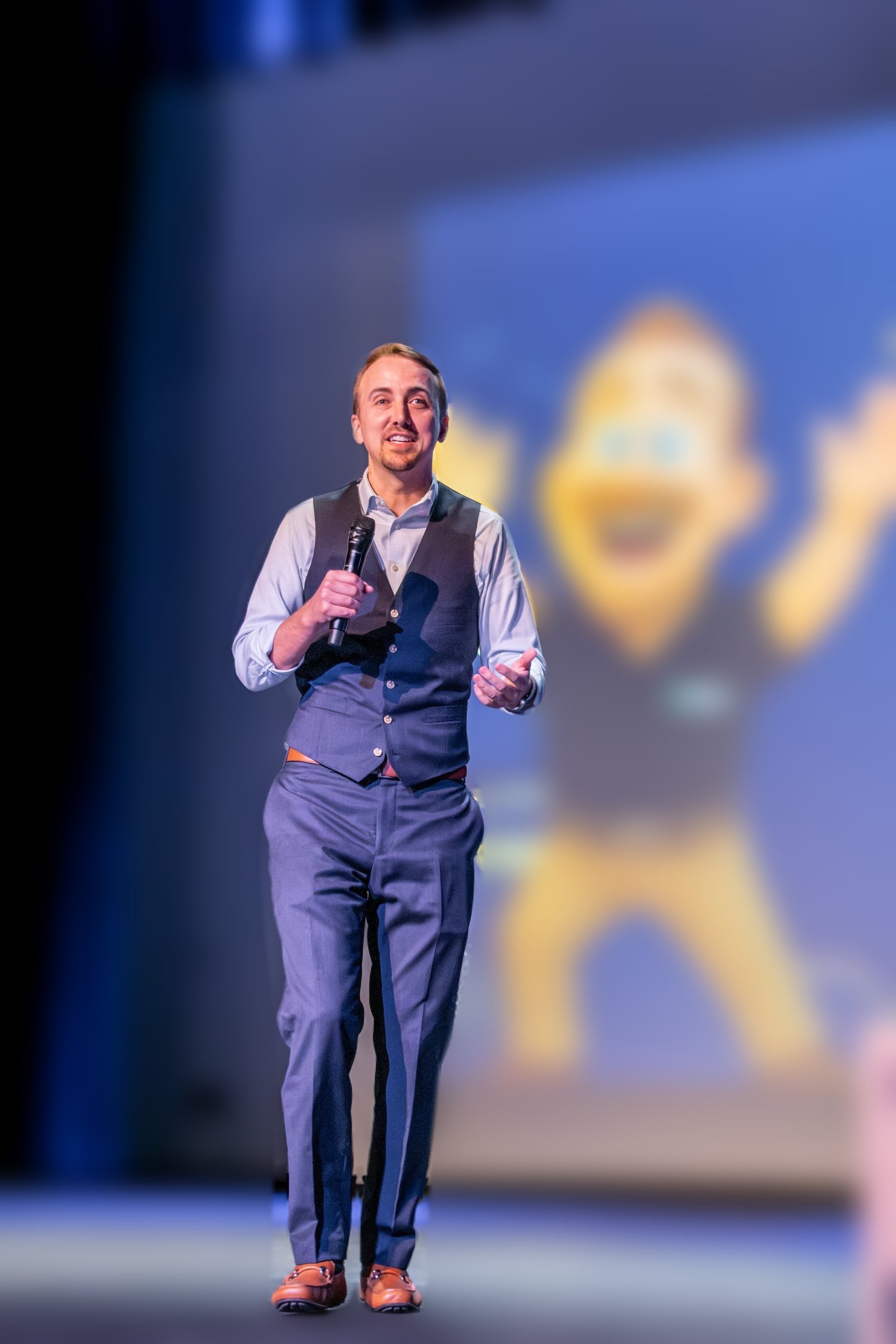 Devan Wyson presenting on stage